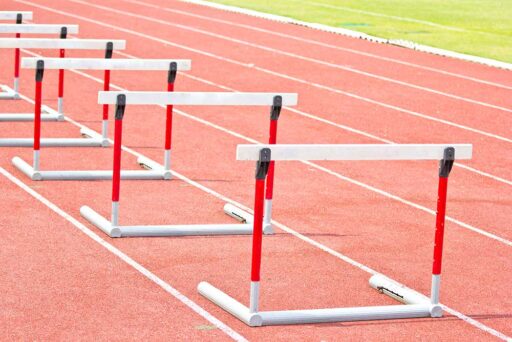 Several hurdles lined up on a running track